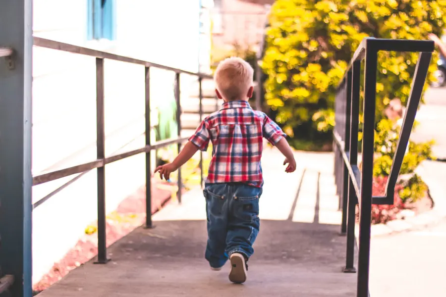 A young boy walking up the ramp into church