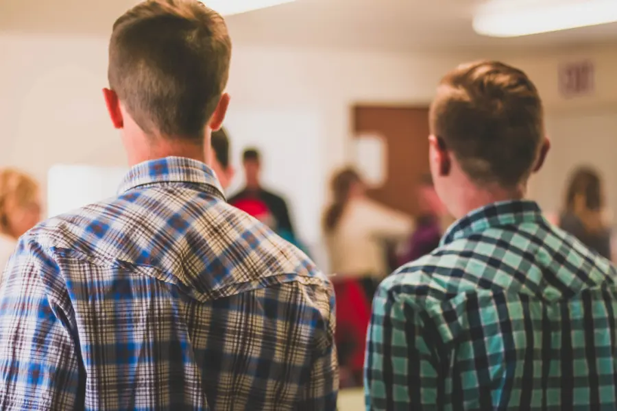 Young men from the youth group in the church fellowship hall